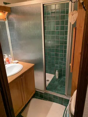 a bathroom with a shower and a sink at Bel appartement au décor Montagnard - 80m2 in Les Contamines-Montjoie