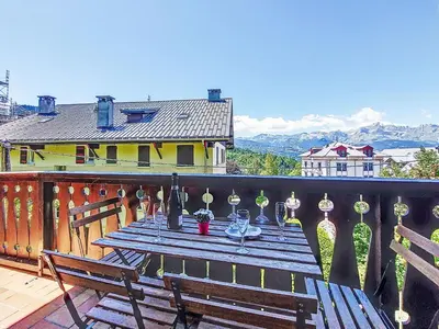 a large building with snow in front of it at Apartment Pointe des aravis B13 by Interhome in Saint-Gervais-les-Bains