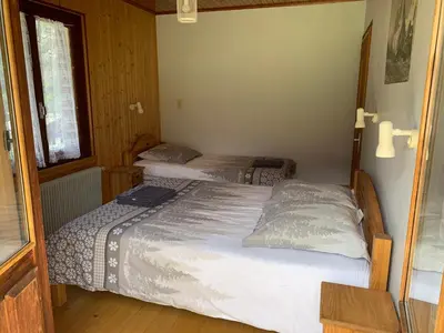 a bedroom with two beds in a room at Le clair logis in Sixt