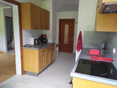 a kitchen with a sink and a counter top at Le clair logis in Sixt