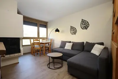 a living room with a couch and a table at Résidence Prarion 1 - Prarion 2 MAE-4874 in Les Houches