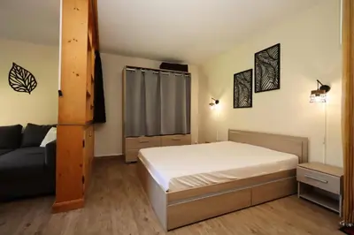 a small bedroom with a bed and a couch at Résidence Prarion 1 - Prarion 2 MAE-4874 in Les Houches