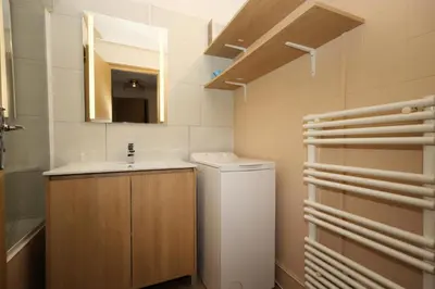 a bathroom with a sink and a toilet and a mirror at Résidence Prarion 1 - Prarion 2 MAE-4874 in Les Houches