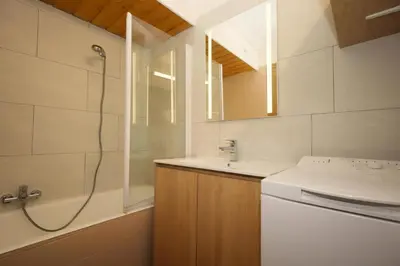 a bathroom with a shower and a sink and a tub at Résidence Prarion 1 - Prarion 2 MAE-4874 in Les Houches