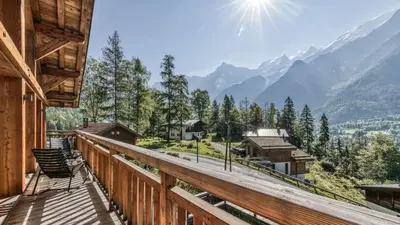a balcony with a view of the mountains at Chalet Hupa in Les Houches