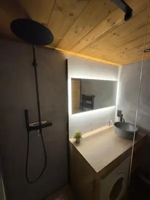 a bathroom with a sink and a mirror at Appartement Lyret centre Chamonix, Vue d'exception in Chamonix-Mont-Blanc