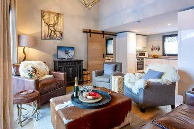 a living room with a couch and chairs and a table at La Cordee 124 Apartment - Chamonix All Year in Chamonix-Mont-Blanc