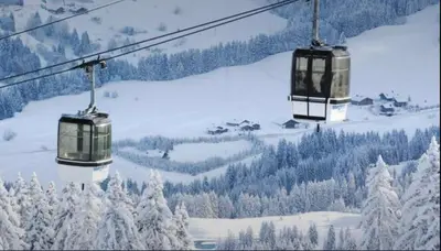 two gondolas on a ski lift in the snow at Interlude Megeve in Megève