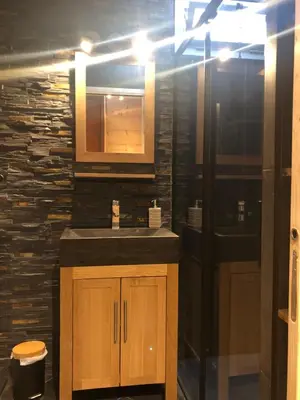 a bathroom with a sink and a mirror at Chamonix centre - WIFI - Parking - Rés Aiguille du midi in Chamonix-Mont-Blanc