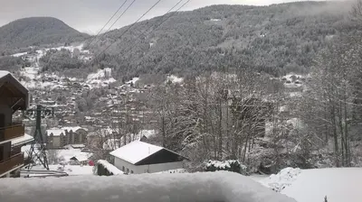 a ski lift in the mountains with snow on the ground at Chalet La Piste Bleu in Saint-Gervais-les-Bains