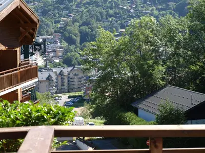 a building with balconies on the side of it at Chalet La Piste Bleu in Saint-Gervais-les-Bains