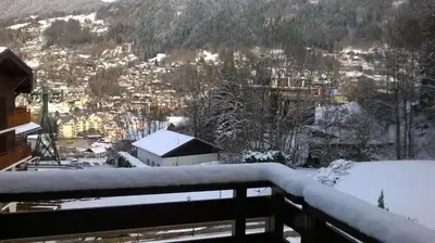 a room with a bed and a wall at Chalet La Piste Bleu in Saint-Gervais-les-Bains
