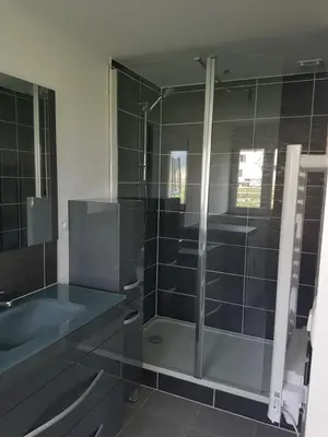 a bathroom with a shower and a sink at maisonnette entre lac de Passy et montagnes in Domancy
