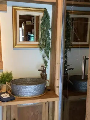 a bathroom with two sinks and a mirror at Charmant Mazot in Saint-Gervais-les-Bains