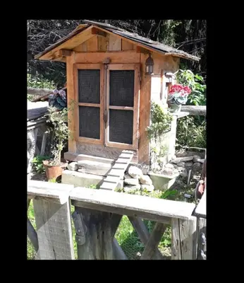 a bird house sitting on top of a wooden platform at Charmant Mazot in Saint-Gervais-les-Bains