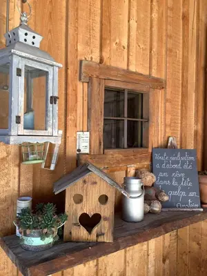 a wooden bird house sitting on a shelf with a sign at Charmant Mazot in Saint-Gervais-les-Bains