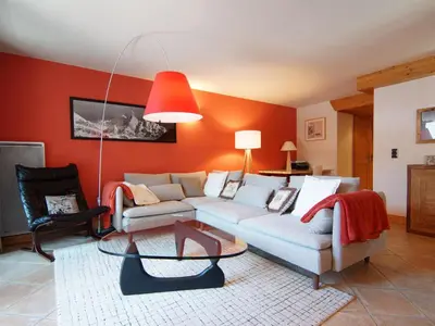 a living room with a couch and a table at Apartment Villa Princesse by Interhome in Chamonix-Mont-Blanc