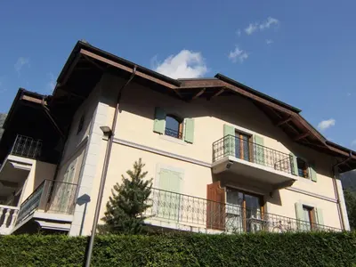 a building with balconies and a tree in front of it at Apartment Villa Princesse by Interhome in Chamonix-Mont-Blanc