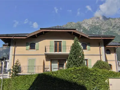a house with a mountain in the background at Apartment Villa Princesse by Interhome in Chamonix-Mont-Blanc
