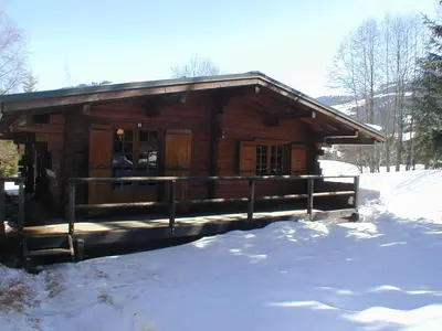 a log cabin with snow in front of it at Chalet plein soleil 2 chambres à Megève, proche pistes - FR-1-453-255 in Megève