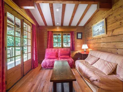 a living room with a couch and a table at Chalet plein soleil 2 chambres à Megève, proche pistes - FR-1-453-255 in Megève