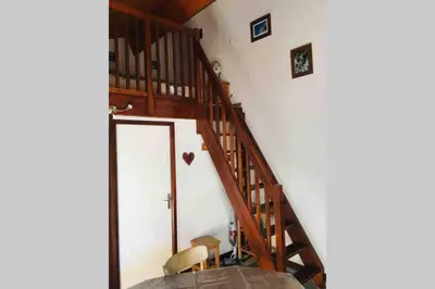 a staircase leading up to a room with white walls at Studio « Au beau soleil » in Saint-Gervais-les-Bains