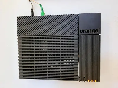 a black object with an orange sign on a wall at Cham'Heart, 4-star apartments in Chamonix centre with free private parking in Chamonix-Mont-Blanc
