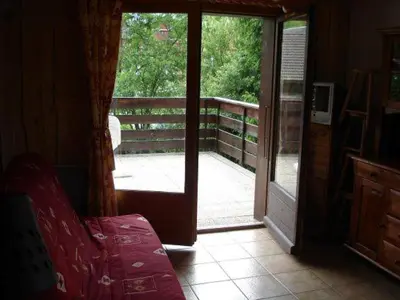 an open door of a house with a porch with a porch at Appartement idéal été ou hiver, pour skieurs et promeneurs, 4 personnes in Saint-Gervais-les-Bains
