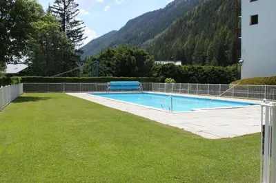 a swimming pool in the yard of a house at studio residence Grands Montets in Chamonix-Mont-Blanc