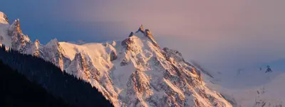 a mountain covered in snow with birds on it at studio residence Grands Montets in Chamonix-Mont-Blanc