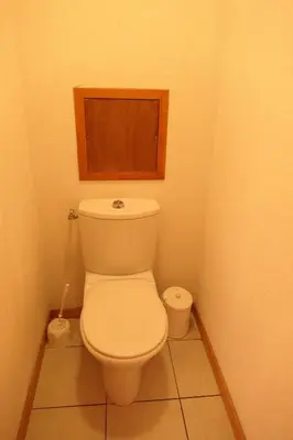 a bathroom with a white toilet in a room at Le Grand Panorama in Saint-Gervais-les-Bains