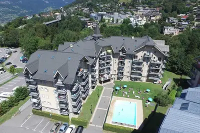 an aerial view of a large apartment building with a pool at Le Grand Panorama in Saint-Gervais-les-Bains