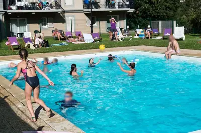 a group of people playing in a swimming pool at Le Grand Panorama in Saint-Gervais-les-Bains