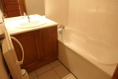 a bathroom with a sink and a bath tub and a sink at Le Grand Panorama in Saint-Gervais-les-Bains