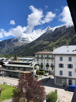 a view of a town with mountains in the background at Studio lumineux neuf dans l'hyper centre avec vue in Chamonix-Mont-Blanc