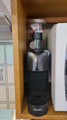 a black blender in a shelf in a kitchen at Cosy studio on the slopes and centre of Chamonix in Chamonix-Mont-Blanc