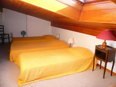 a bedroom with a bed and a table with a lamp at Résidence Les Cristaux Du Haut - Cristaux 51 MAE-5310 in Combloux