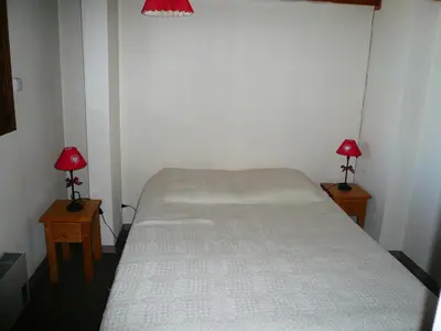 a bedroom with a bed and two lamps on tables at Résidence Les Cristaux Du Haut - Cristaux 51 MAE-5310 in Combloux