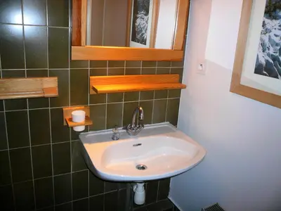 a bathroom with a sink and a mirror at Résidence Les Cristaux Du Haut - Cristaux 51 MAE-5310 in Combloux