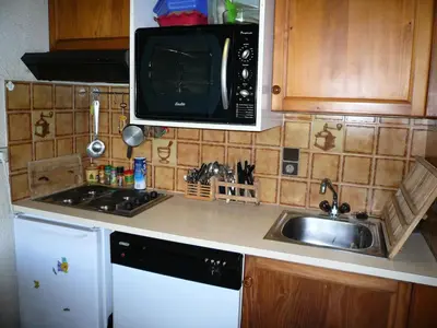 a kitchen with a sink and a microwave at Résidence Les Granges D'ormaret - Grandes d'Ormaret 16 MAE-5318 in Combloux