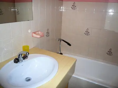 a bathroom with a sink and a bath tub at Résidence Les Granges D'ormaret - Grandes d'Ormaret 16 MAE-5318 in Combloux