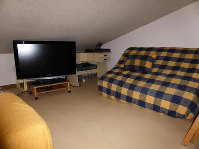 a living room with a television and a couch at Résidence Le Royal - Royal 16 MAE-5321 in Combloux