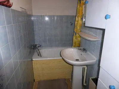 a bathroom with a sink and a toilet and a tub at Résidence Le Royal - Royal 16 MAE-5321 in Combloux