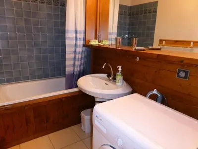 a bathroom with a sink and a toilet and a tub at Résidence Gros Cailloux Amethyste - Gros Cailloux A7 MAE-5328 in Combloux