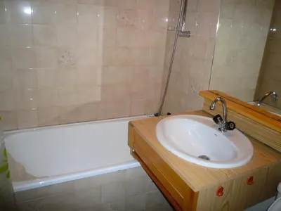 a bathroom with a sink and a bath tub at Résidence Les OrÉades - Oréades B04 MAE-5329 in Combloux
