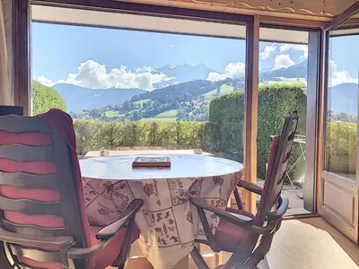 a table and two chairs in front of a window at Charmant studio près du centre de Combloux avec kitchenette - FR-1-560-54 in Combloux