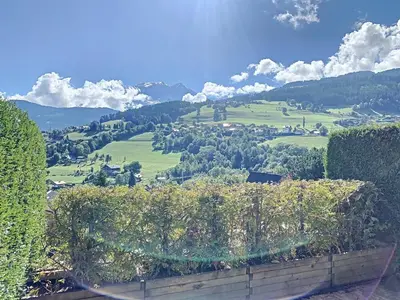 a view of a green valley with trees and houses at Charmant studio près du centre de Combloux avec kitchenette - FR-1-560-54 in Combloux