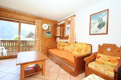 a living room with a couch and a table at Résidence Les Hauts De Chavants - Hauts de Chavants Bellachat 1 MAE-7730 in Les Houches