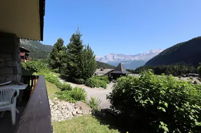 a balcony of a house with mountains in the background at Résidence Les Hauts De Chavants - Hauts de Chavants Bellachat 1 MAE-7730 in Les Houches