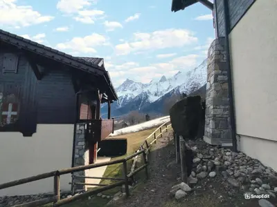 a view of a snowy mountain from a building at Résidence Les Hauts De Chavants - Hauts de Chavants Bellachat 1 MAE-7730 in Les Houches